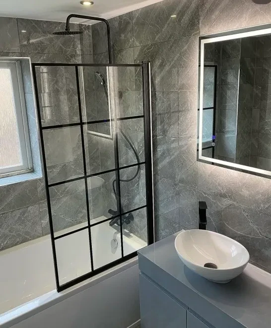 Grey marble bathroom with black-framed shower screen