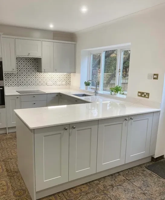 White shaker kitchen with marble island