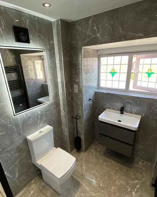 Grey marble bathroom with wall-hung basin
