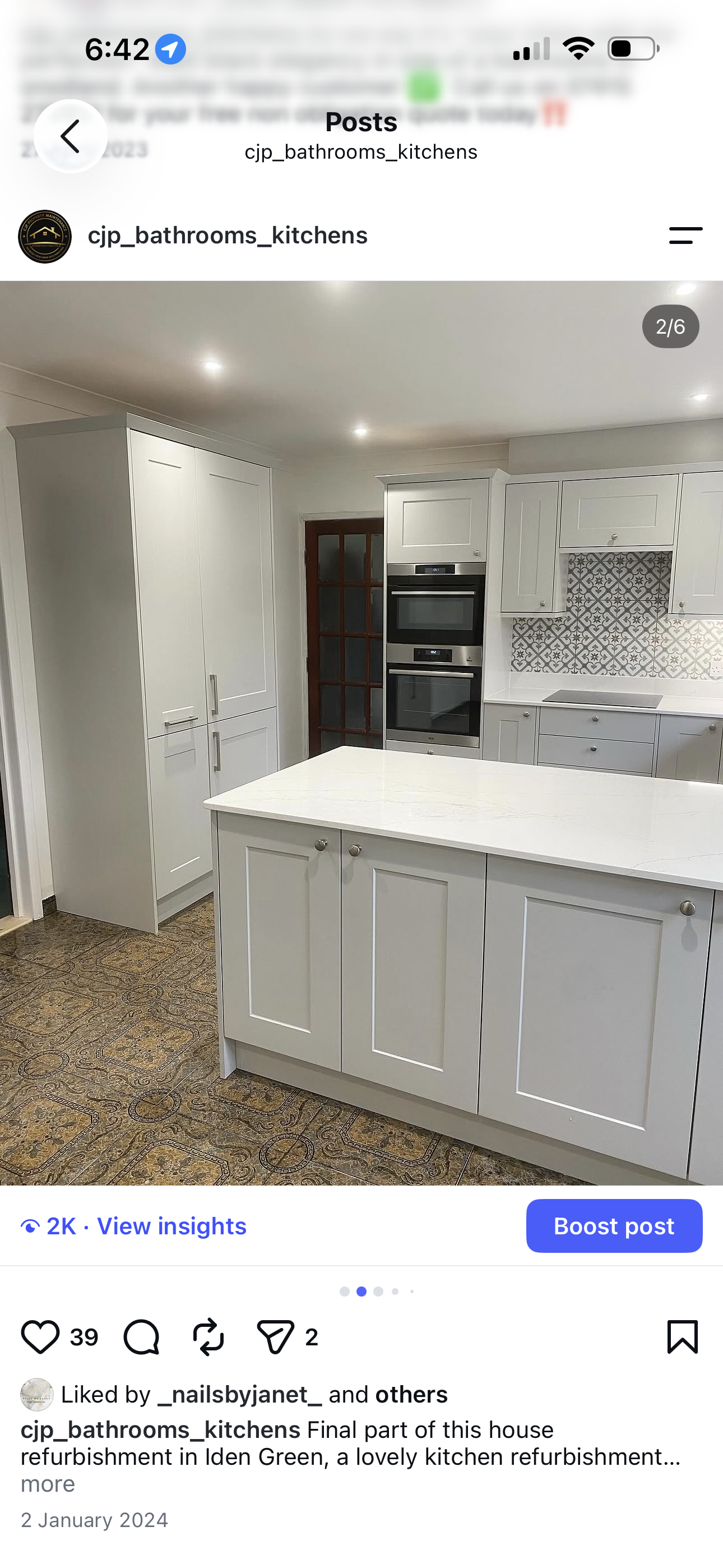 Grey shaker kitchen with full-height tower unit, integrated double ovens and patterned tile splashback